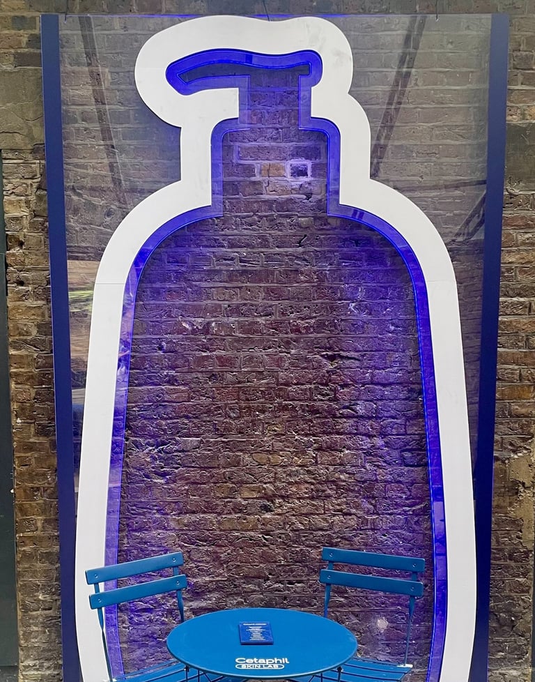 Cetaphil neon sign in bottle shape at Covent Garden event.