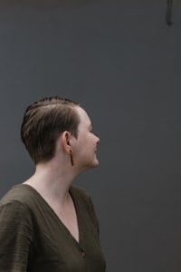 Side view of sleek haircut for straight fine hair.