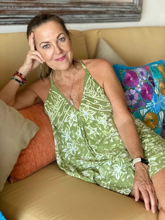 Relaxed portrait of Erin, yoga instructor hosting grief and wellness retreats for women in Mexico