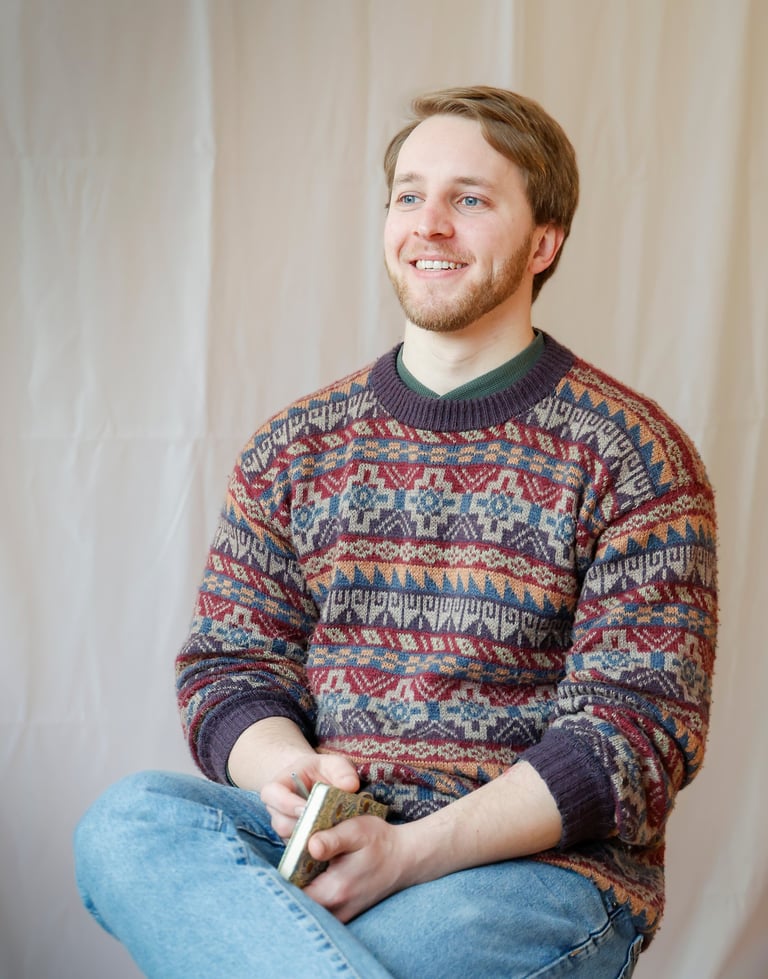 Coach Tilman sitting smiling