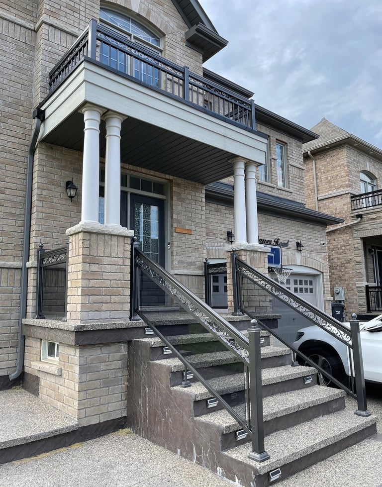 front stairway with grey tinted glass railings
