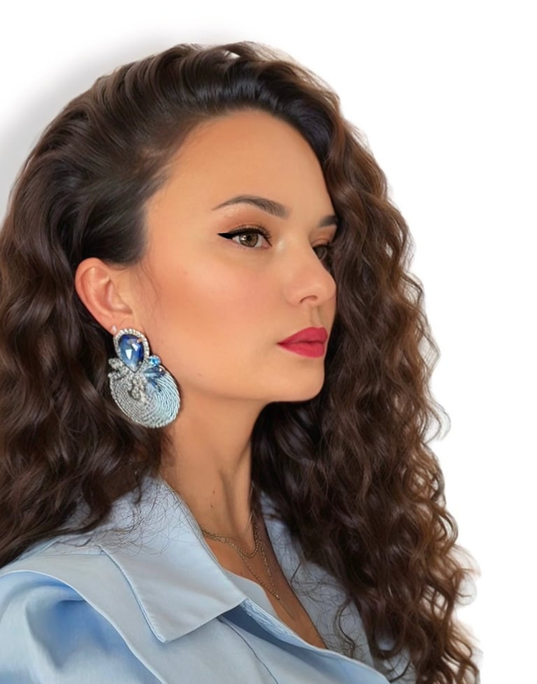 a woman with long hair and earrings on her earrings