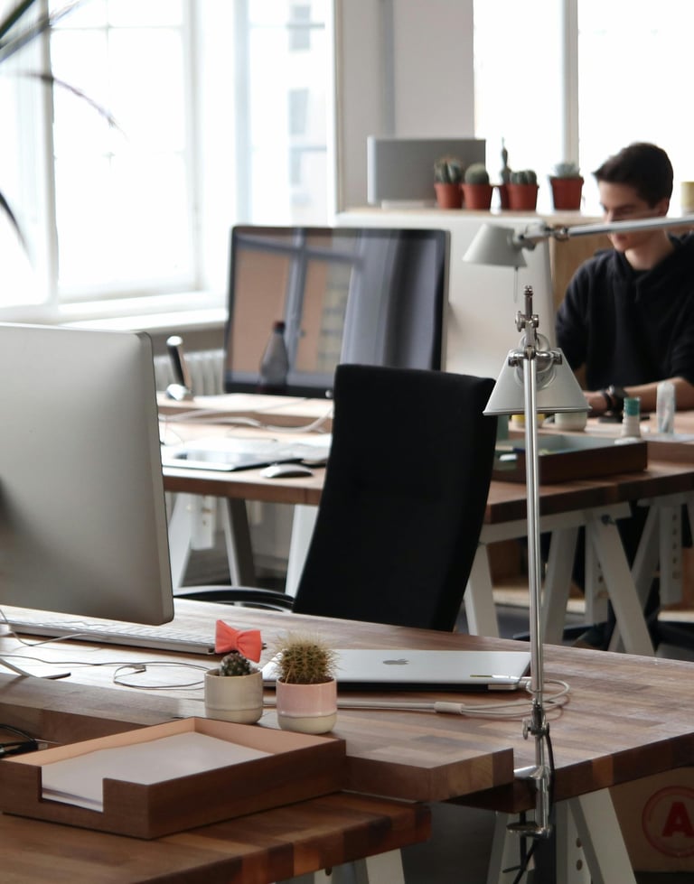 Modern office workspace with computer stations representing IT support and managed services by TotalScope Technologies