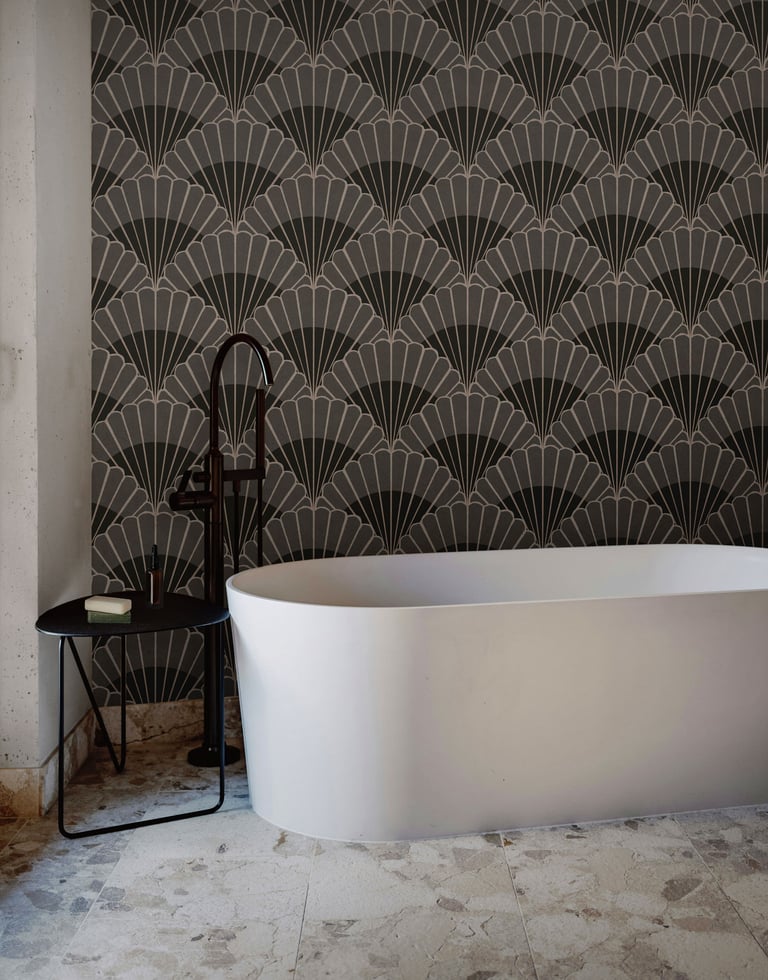 Charcoal and grey Art Deco wallpaper with bold fan motifs, styled in a modern bathroom with a freest