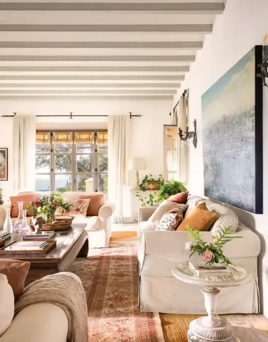 Living room with beams and garden views at Finca Santa Katerina