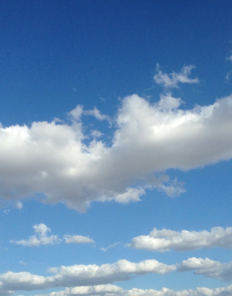 Beautiful baby blue sky with big white cumulus 