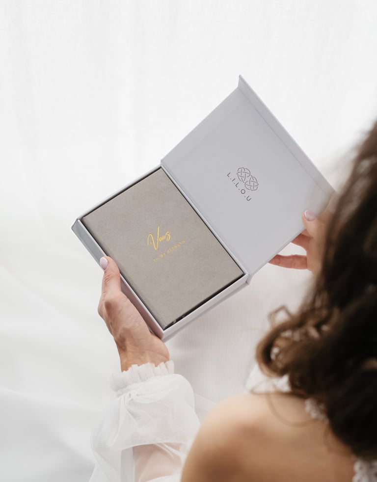 bride holding a vow book