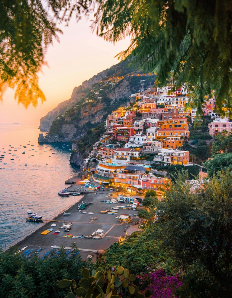 Colourful hillside village in Amalfi coast, at sunset overlooking the sea.
