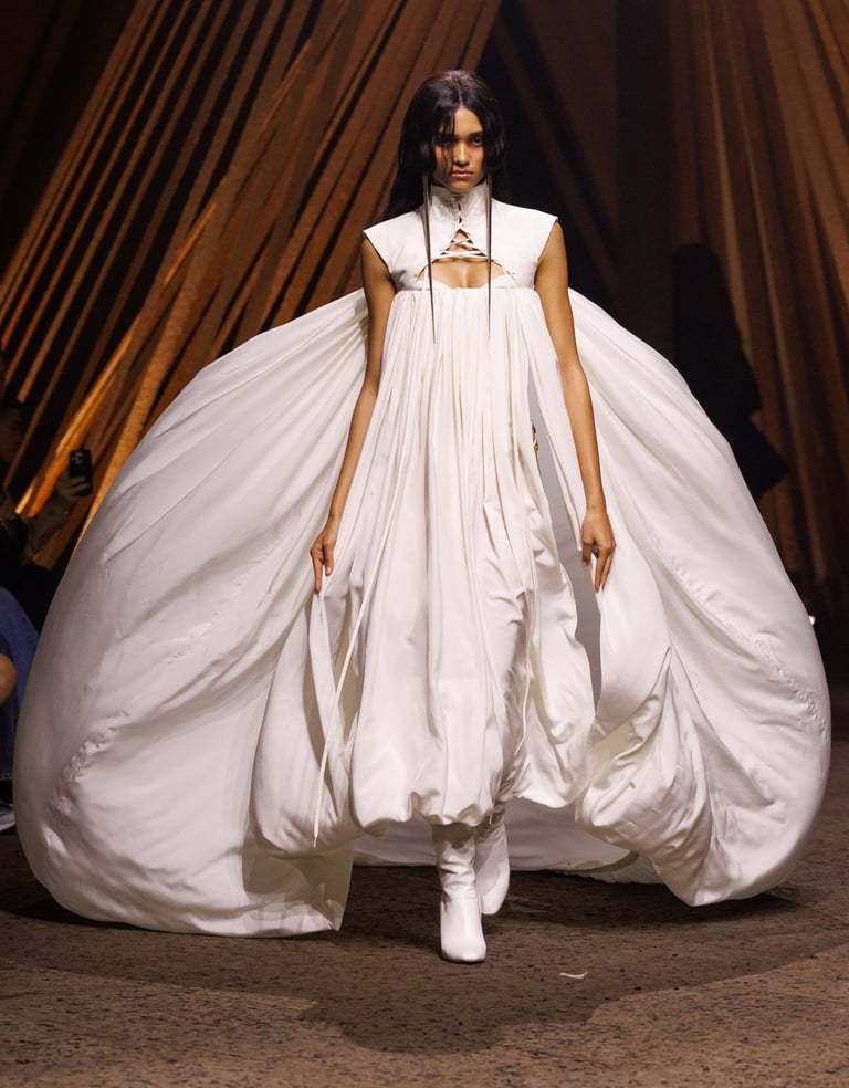Alexander McQueen Spring Summer 2026 – Voluminous white gown with sculptural silhouette.