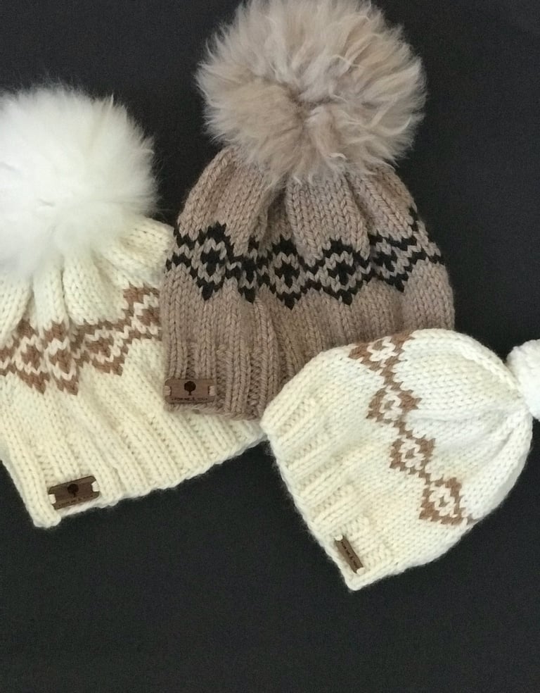 Three knitted hats with pom pom pom 