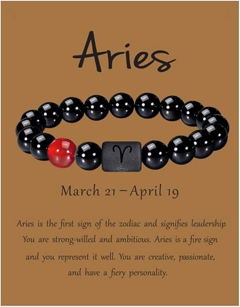 Aries zodiac bracelet with black onyx beads and a red agate stone on a descriptive gift card.