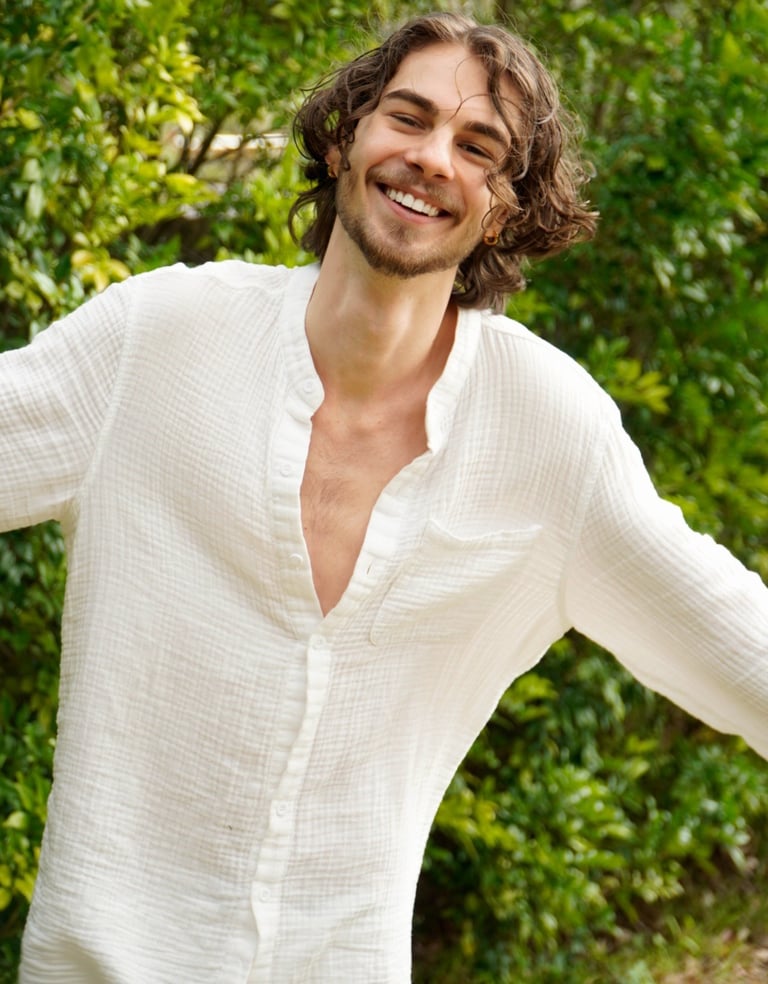 a man with a beard and a white shirt