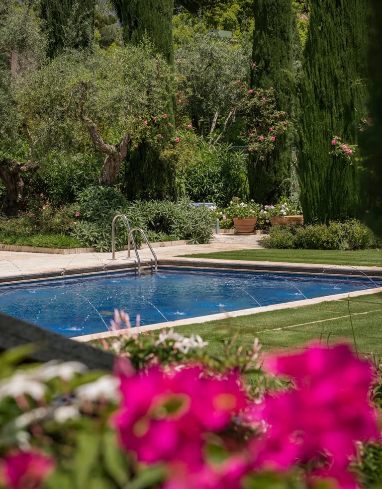 Swimming pool surrounded by landscaped gardens in Marbella