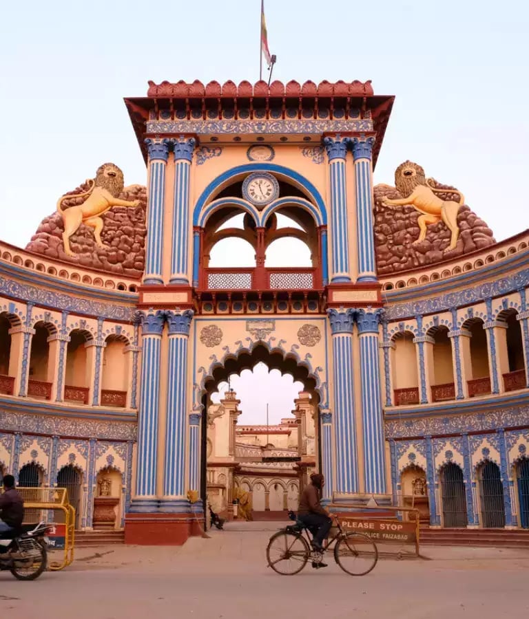 a man riding a bicycle through a large building