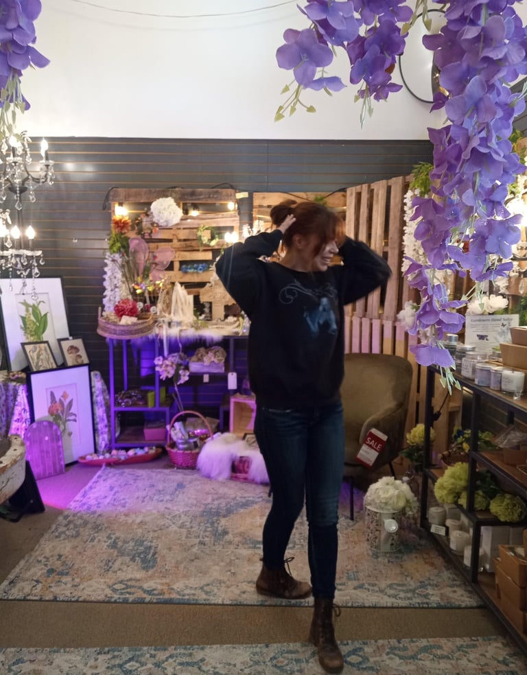Maddy Fay Robinson hangs in the Fairy section of decor warehouses