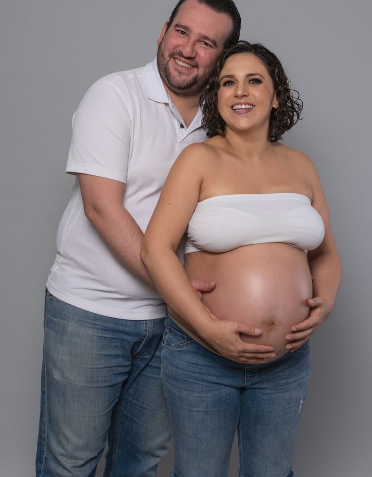 a pregnant woman and her husband are posing for a photo