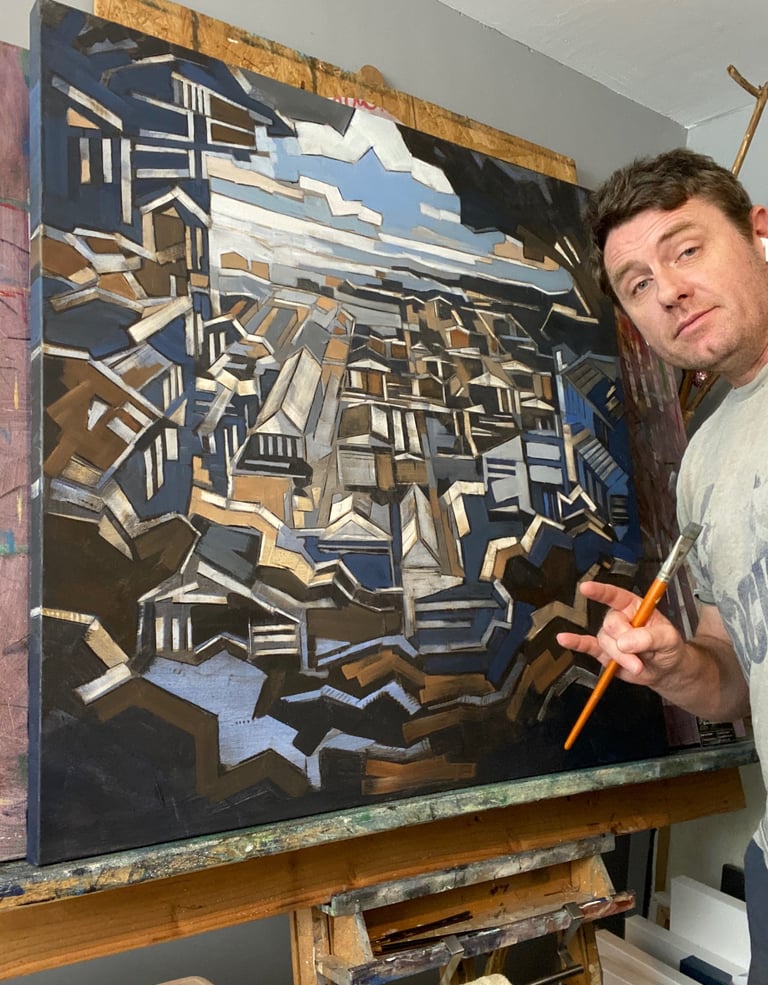 Justin Shaver with large-scale architectural abstract oil painting in Columbus studio
