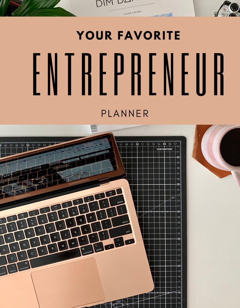 a laptop computer and a cup of coffee with a planner