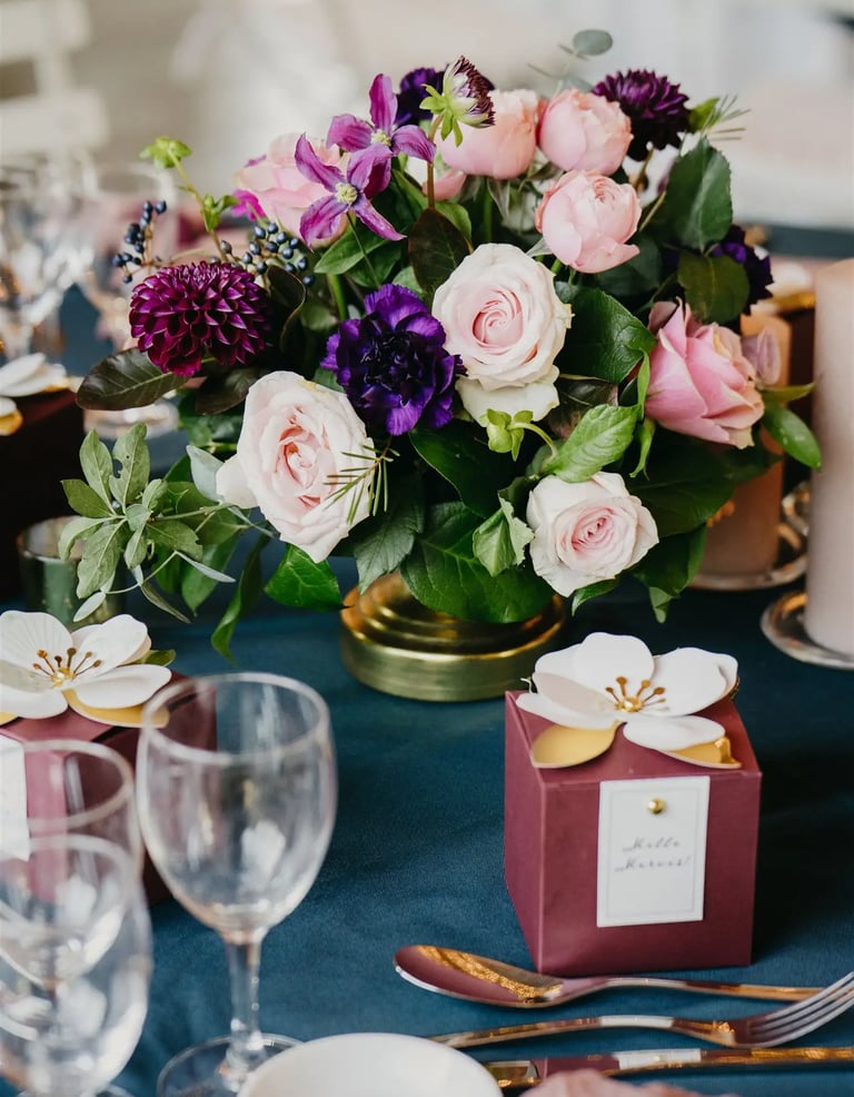 Luxury editorial wedding table detail with floral centerpiece in Provence
