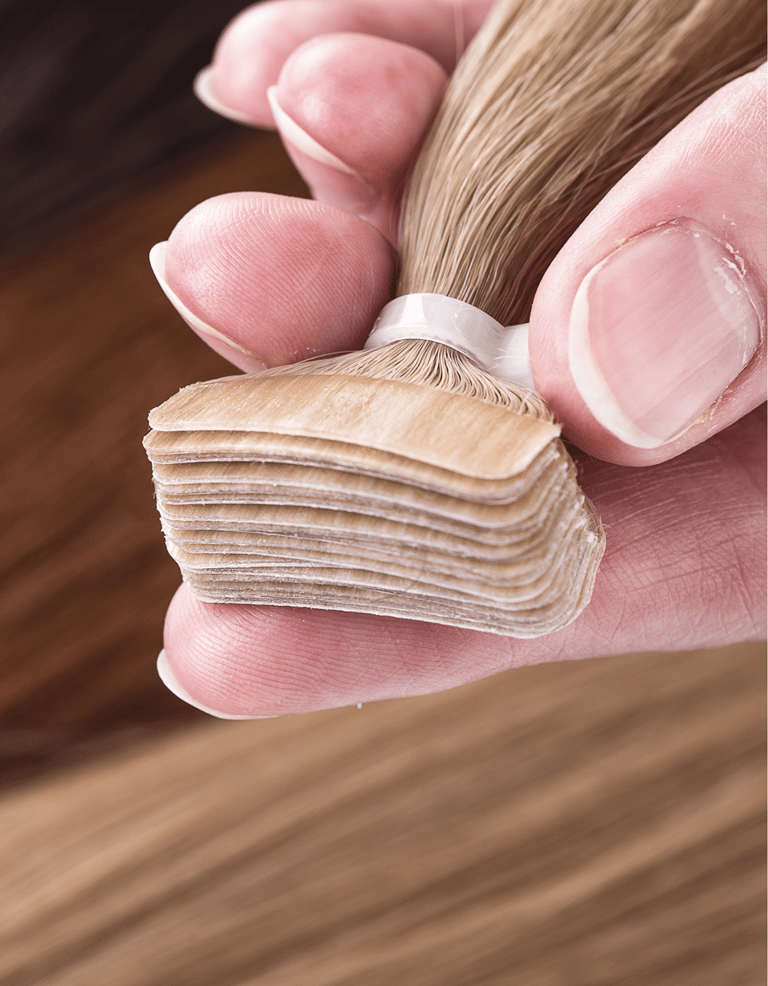 a person holding Tape-Extensions