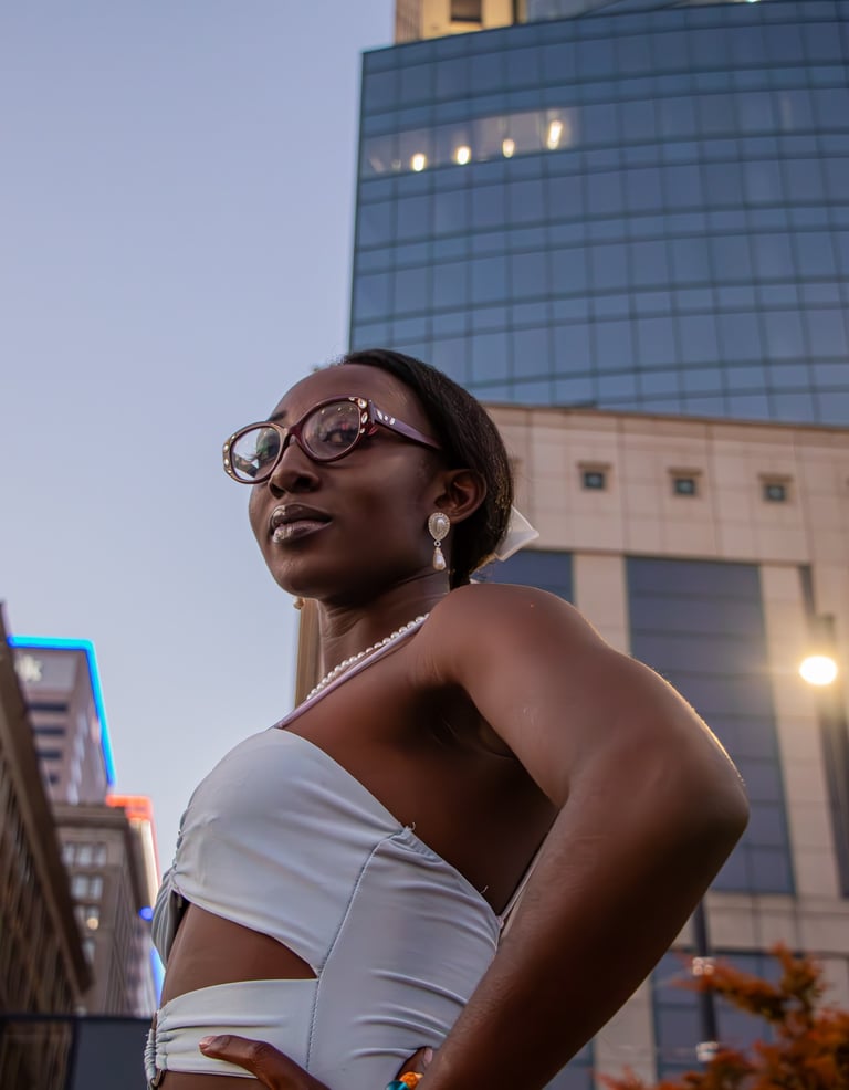 A woman posing in the midst of a skyscrapper