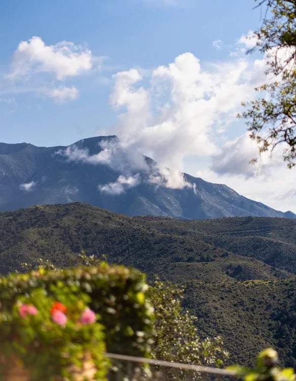 Mountain view with clouds and greenery at Finca Santa Katerina
