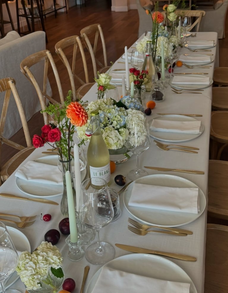 a table with a long table set for a dinner