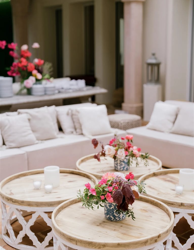 Wedding reception lounge with floral centrepieces