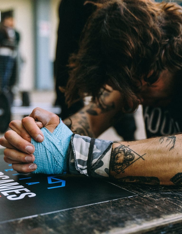 a man with tattoos on his arm and arm