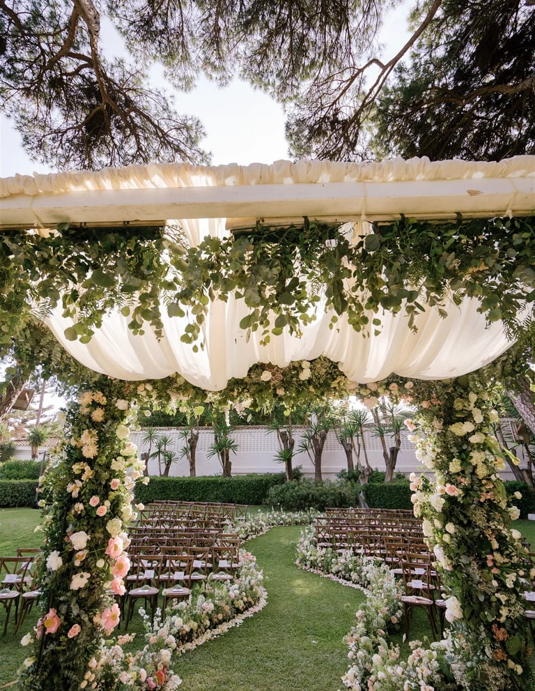 Floral wedding canopy with garden ceremony seating