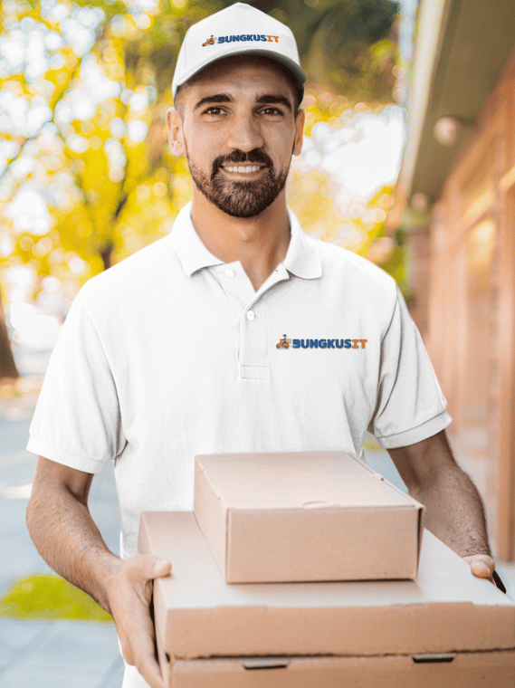 a man in a white shirt is holding a box of pizza