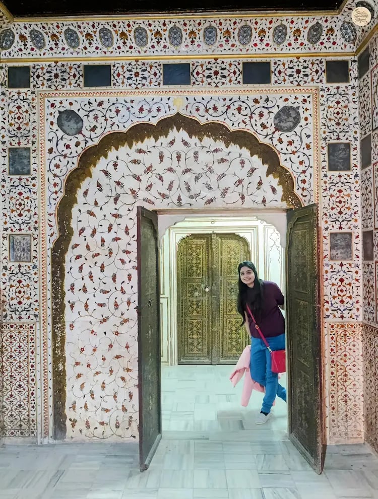 Interior of Phool Mahal in Bikaner with walls adorned in royal floral designs.