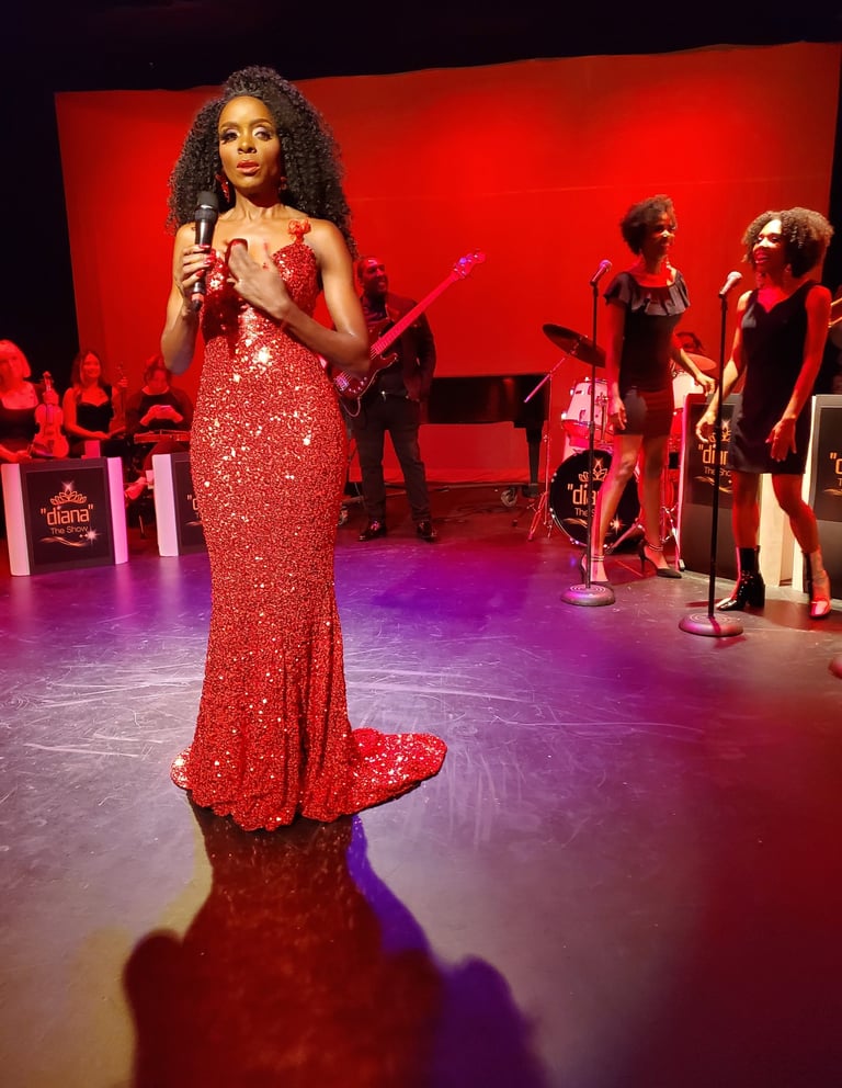 a woman in a red dress standing in front of a microphone