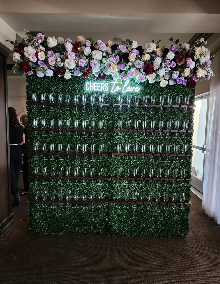 champagne walll burgundy themed floral arrangement