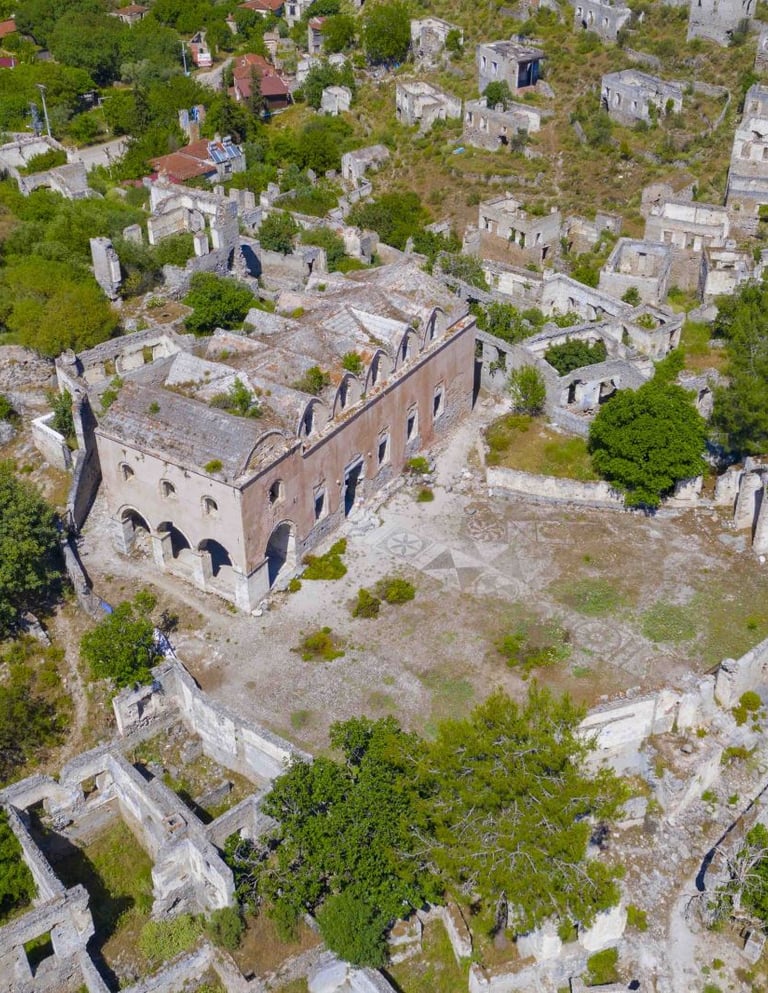 Aerial view of the historic stone ruins and abandoned Greek houses in Kayakoy ghost village, Turkey.