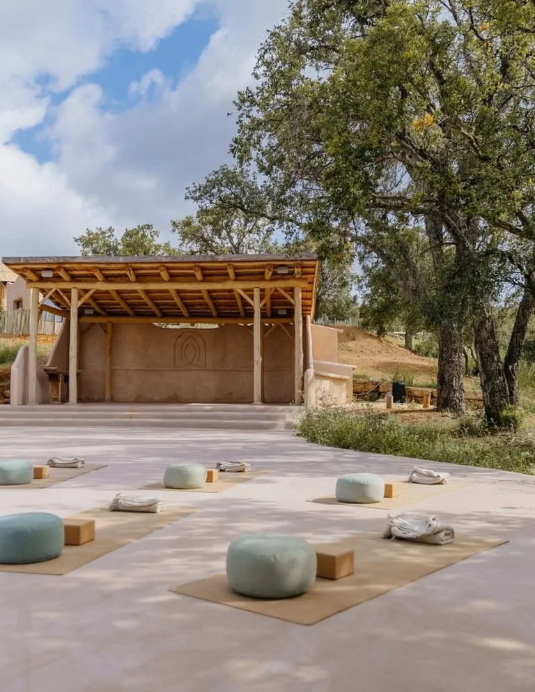 Outdoor yoga shala surrounded by trees and countryside