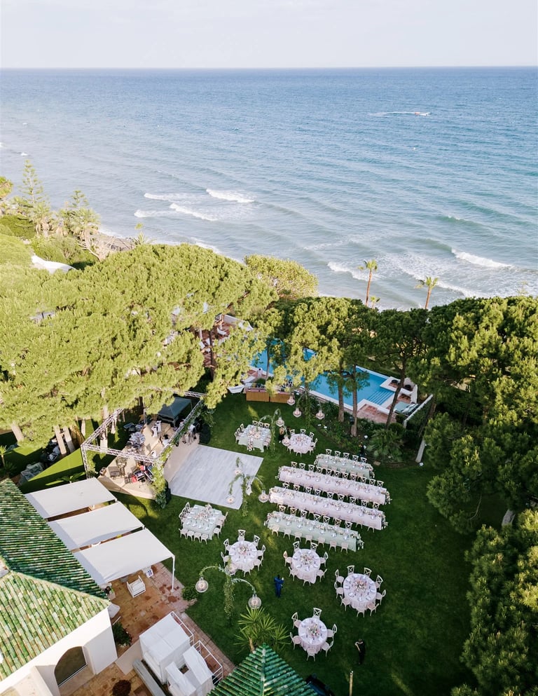 Aerial view of beachfront wedding reception in Marbella