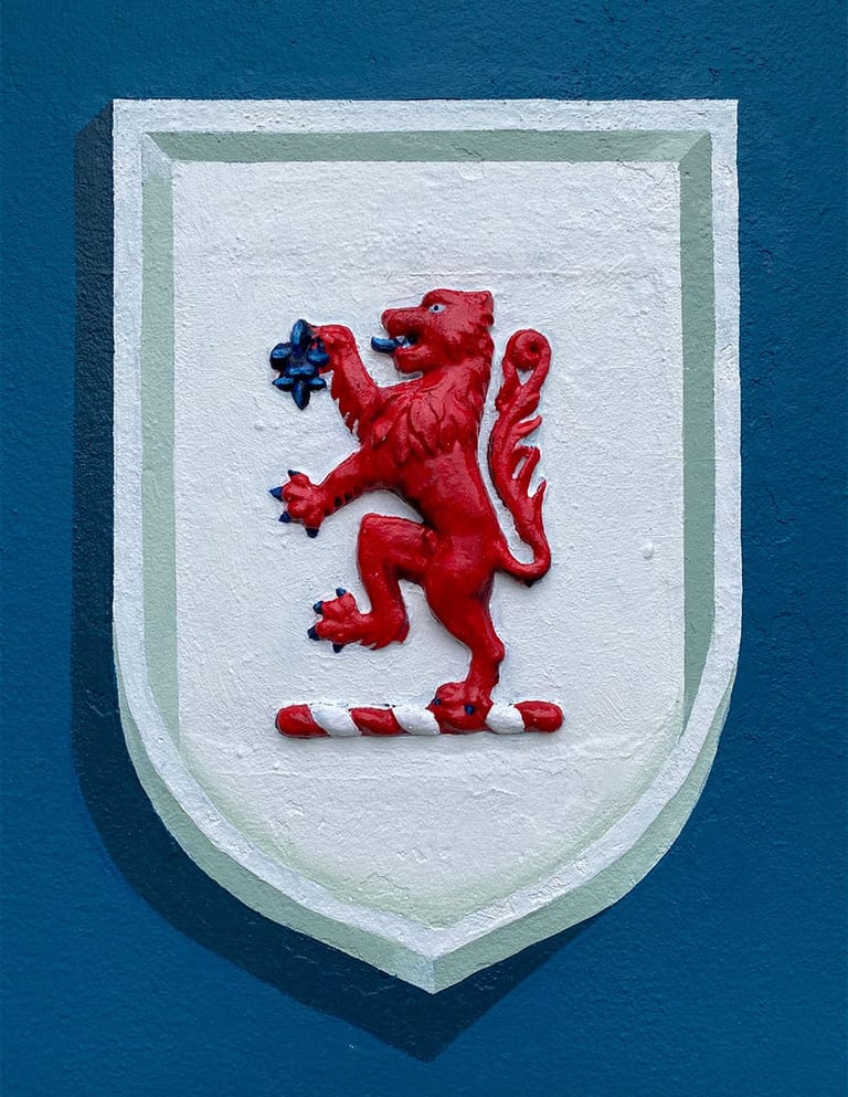 Vibrant lion rampant is surrounded by a crisp white trompe l'oeil shield