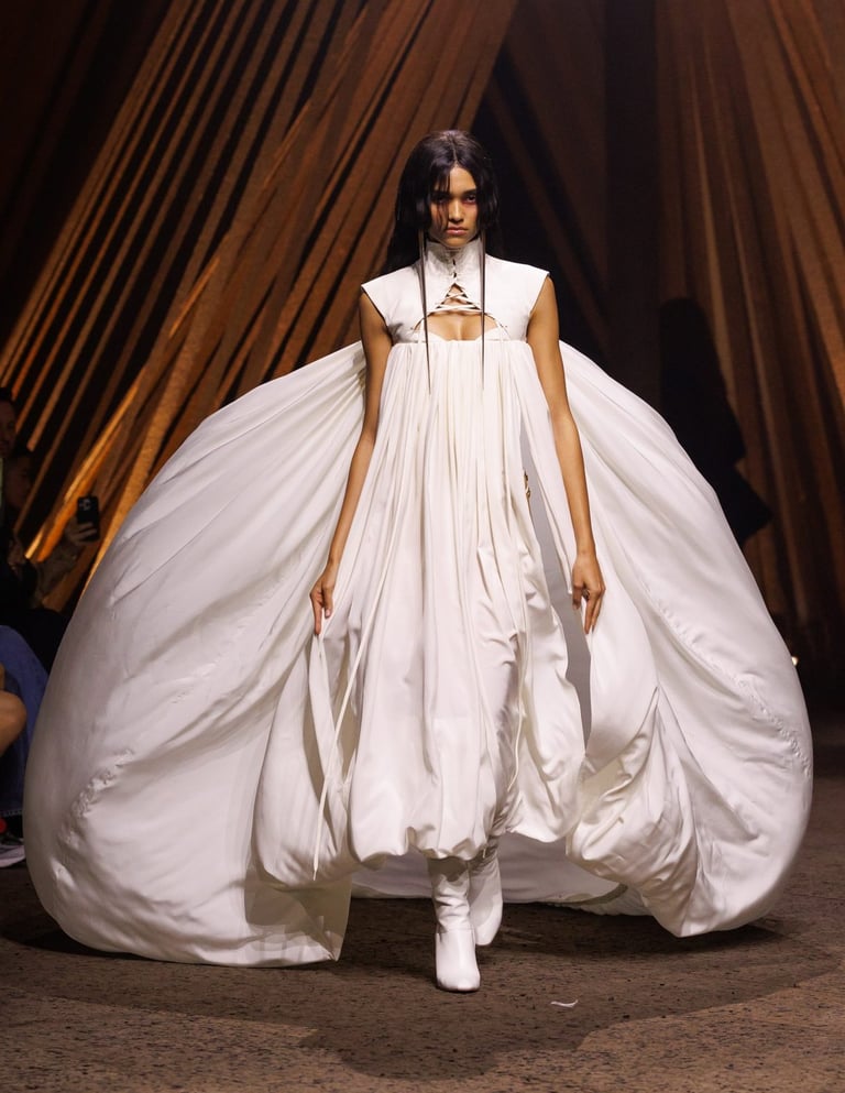 Alexander McQueen Spring Summer 2026 – Voluminous white gown with sculptural silhouette.