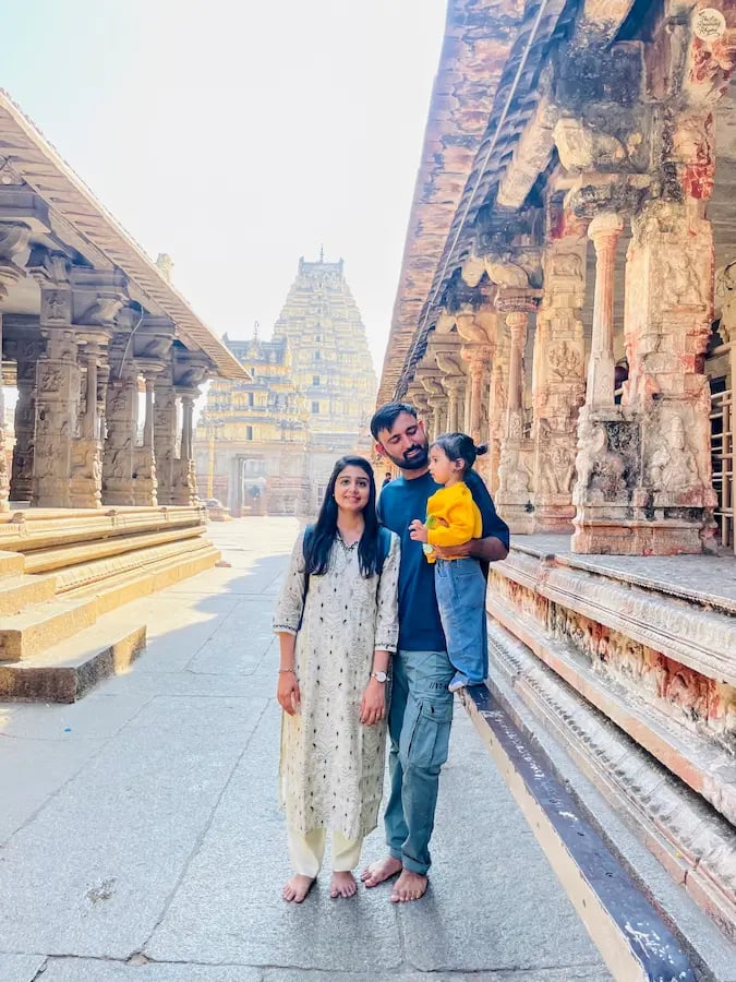 Family moments at Virupaksha Temple, experiencing the blessings of Hampi.