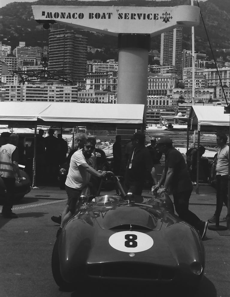 a race car parked in the paddock