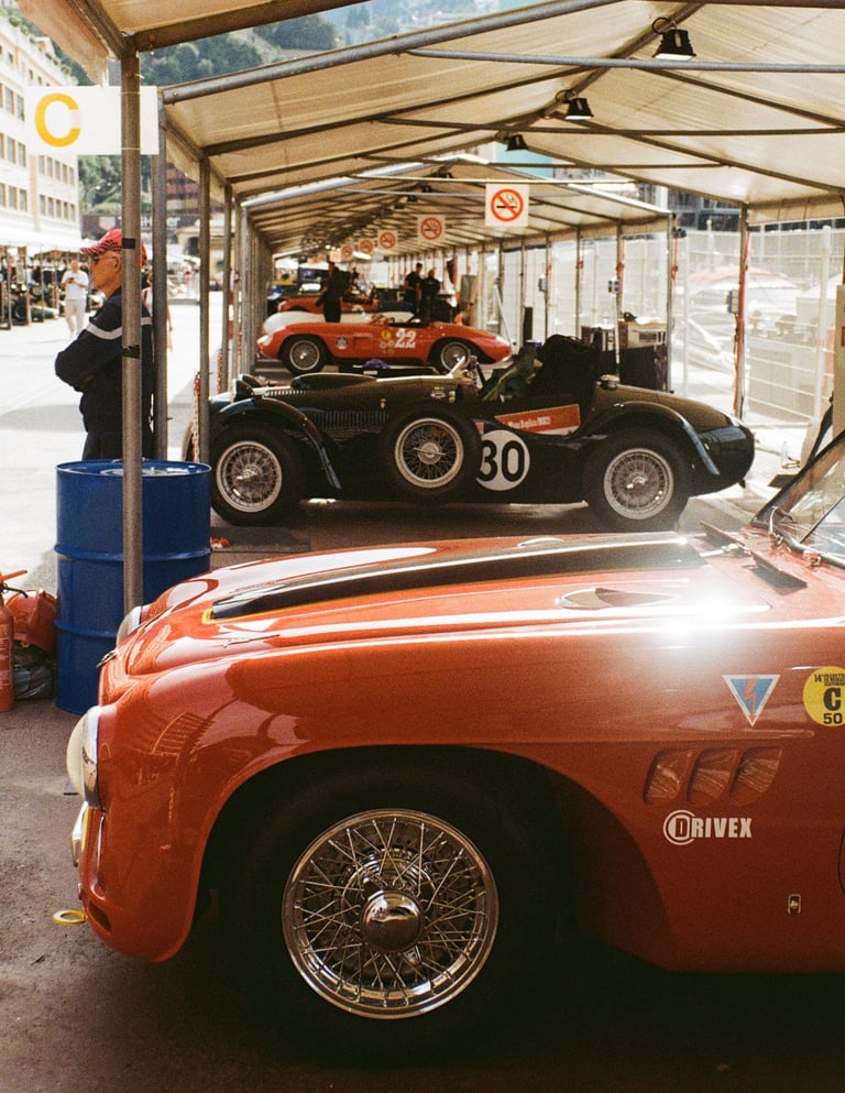 a race car parked in the paddock