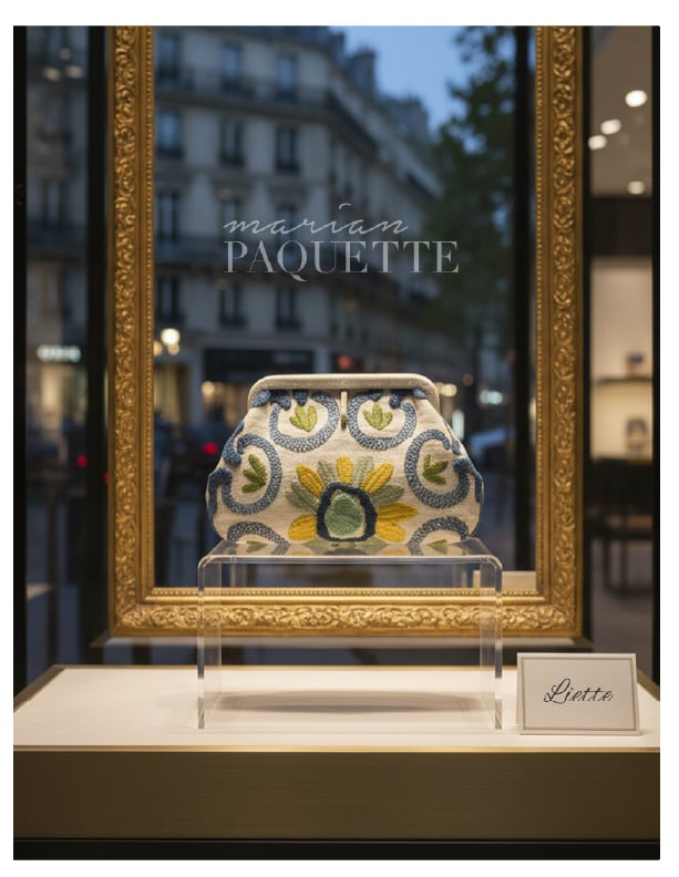 Marian Paquette embroidered clutch bag on display in a Parisian boutique window.