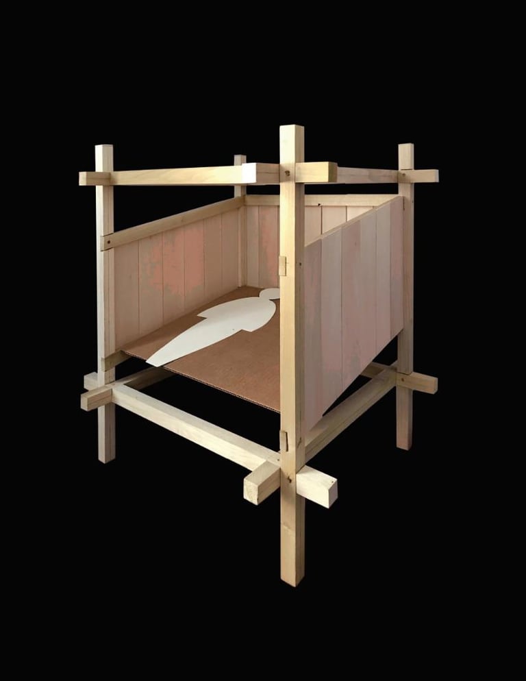 A photo of a wooden architectural model