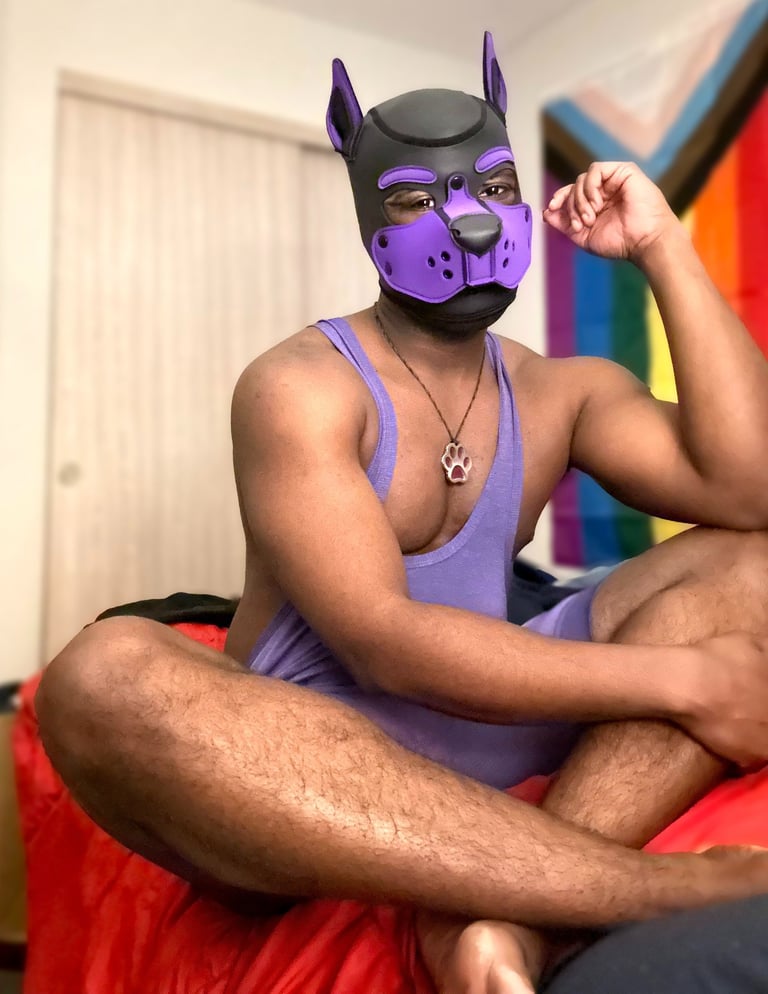 Man relaxing in a pup mask.