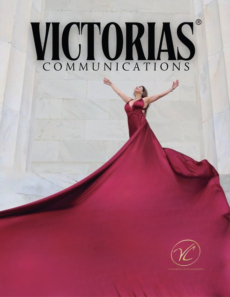 Woman in a flowing red gown posing for Victorias Communications against a white marble background.