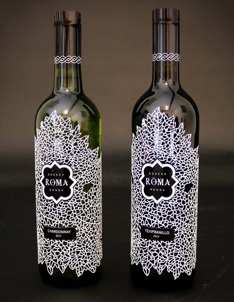Two wine bottles on dark background