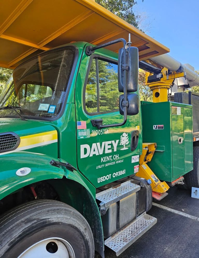 Green Davey utility service truck after key made in Spruce Pine, NC
