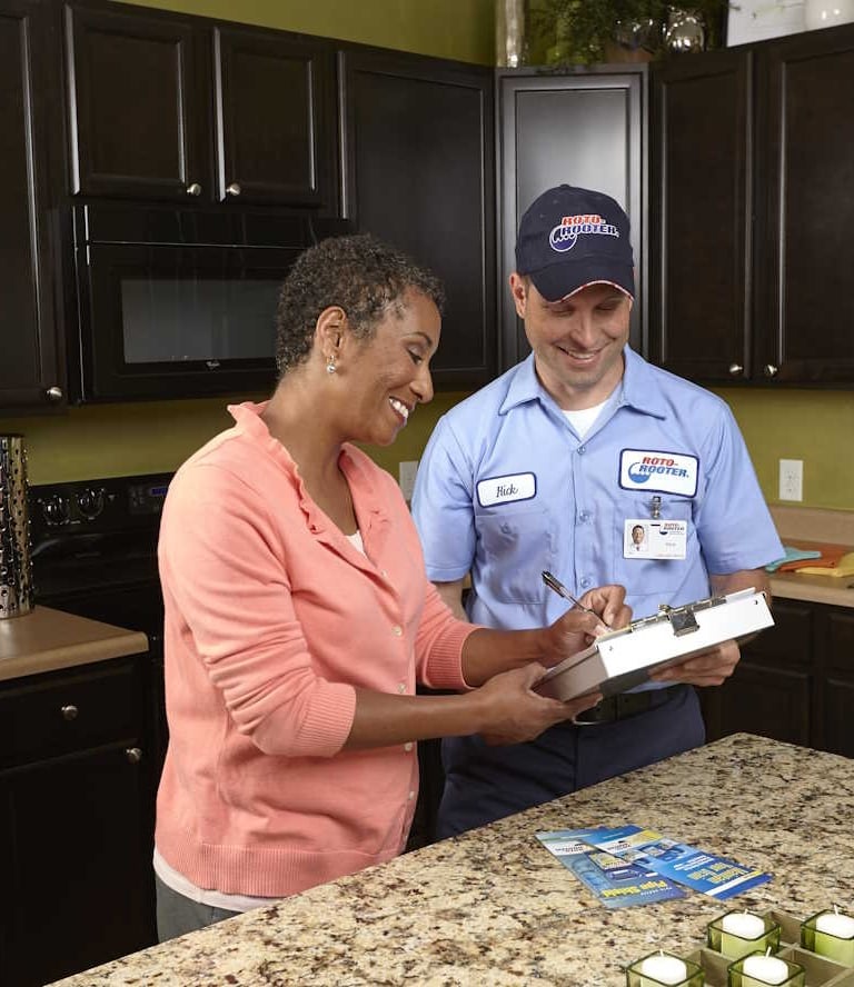 Plumbing Tech With Female Client
