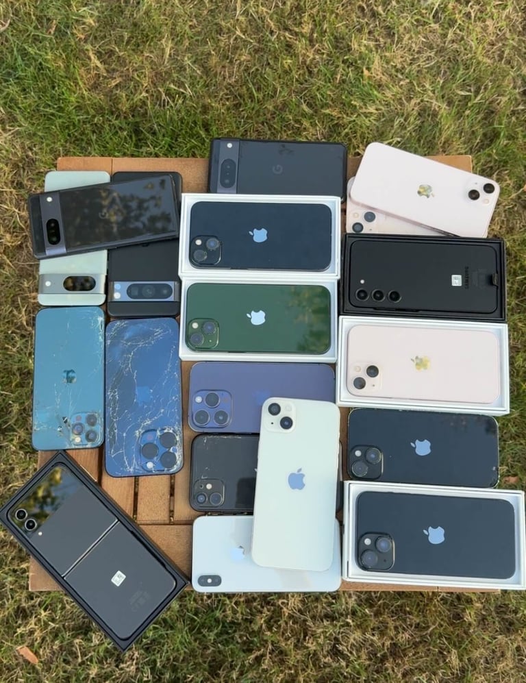 a bunch of different colored iphones on a table